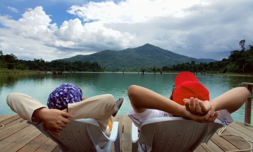 Two man relax and enjoying peaceful lake view
