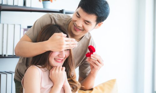 Young asian man asking women for wedding engagement with the ring